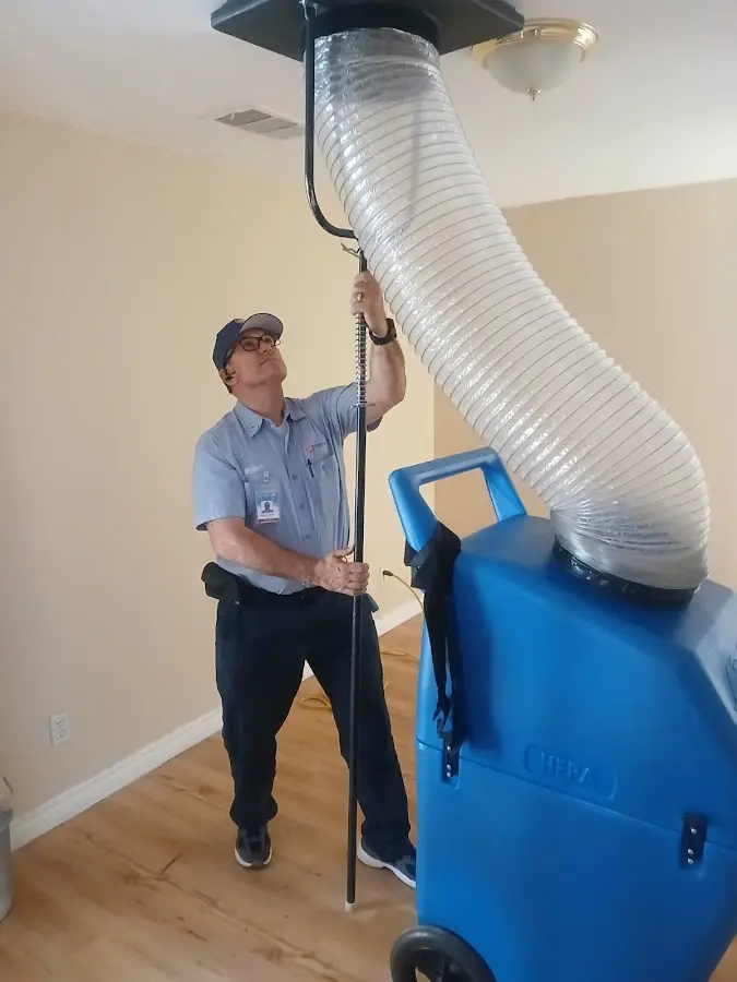 Furnace Tune-Up technician using HEPA equipment in Sycamore
